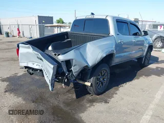 2021 Toyota Tacoma SR5 with VIN 5TFAZ5CN7MX101810, listed as a IAAI auction lot 42454418 with 58,930 mi miles and . Bid and sale history available at DreamBid. Image 4.