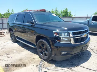 2015 Chevrolet Suburban LT z VIN 1GNSKJKC9FR597953, wystawiony jako IAAI lot #42376903 z przebiegiem 258 042 mil mil oraz . Historia ofert i sprzedaży dostępna na DreamBid. Obrazek 1.