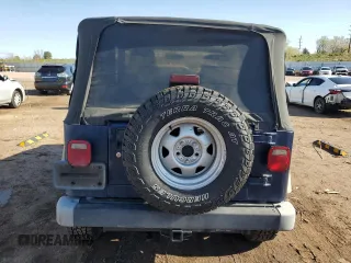 2003 Jeep Wrangler X z VIN 1J4FA39S43P338732, wystawiony jako Copart lot #56315495 z przebiegiem 135 480 mil mil oraz Szkoda całkowita • Salvage title. Historia ofert i sprzedaży dostępna na DreamBid. Obrazek 6.