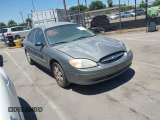 2001 Ford Taurus LX Standard z VIN 1FAFP52U61A187636, wystawiony jako IAAI lot #42477322 z przebiegiem 118 467 mil mil oraz . Historia ofert i sprzedaży dostępna na DreamBid. Obrazek 1.