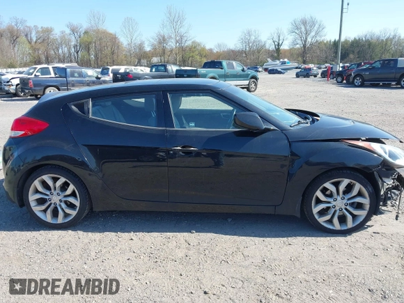 2013 Hyundai Veloster w/Gray Int with VIN KMHTC6AD4DU131242, listed as a IAAI auction lot 42074517 with 76,713 mi miles and . Bid and sale history available at DreamBid. Image 13.