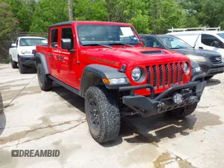 2021 Jeep Gladiator Mojave with VIN 1C6JJTEG6ML533927, listed as a IAAI auction lot 42056253 with 92,317 mi miles and . Bid and sale history available at DreamBid. Image 1.