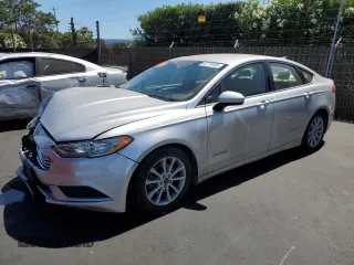 2017 Ford Fusion Hybrid SE z VIN 3FA6P0LU9HR217973, wystawiony jako Copart lot #63719405 z przebiegiem 185 241 mil mil oraz Szkoda całkowita • Salvage title. Historia ofert i sprzedaży dostępna na DreamBid. Obrazek 1.