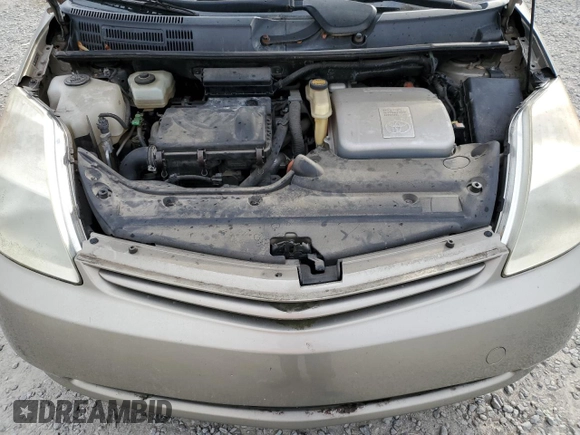 2005 Toyota Prius z VIN JTDKB20U053070122, wystawiony jako Copart lot #86879114 z przebiegiem Nie podano mil oraz Szkoda całkowita • Salvage title. Historia ofert i sprzedaży dostępna na DreamBid. Obrazek 11.