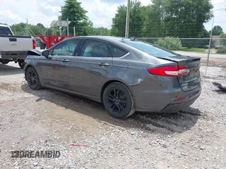 2020 Ford Fusion SE z VIN 3FA6P0HD6LR160147, wystawiony jako IAAI lot #42499983 z przebiegiem 73 971 mil mil oraz . Historia ofert i sprzedaży dostępna na DreamBid. Obrazek 3.