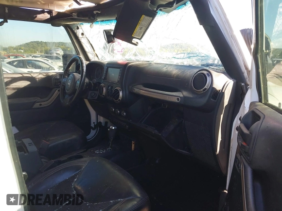 2016 Jeep Wrangler Unlimited Sahara with VIN 1C4BJWEG5GL243004, listed as a IAAI auction lot 40438321 with 121,360 mi miles and . Bid and sale history available at DreamBid. Image 5.