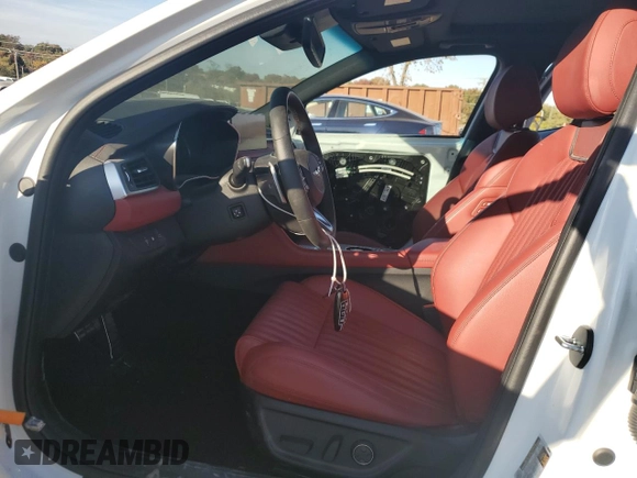 2023 Genesis G70 2.0T with VIN KMTG34TA1PU134120, listed as a Copart auction lot 77657374 with 12,024 mi miles and Salvage Title. Bid and sale history available at DreamBid. Image 7.