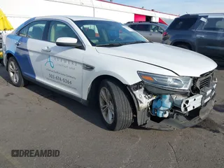 2015 Ford Taurus SEL z VIN 1FAHP2E8XFG182191, wystawiony jako IAAI lot #41067900 z przebiegiem 42 508 mil mil oraz . Historia ofert i sprzedaży dostępna na DreamBid. Obrazek 1.