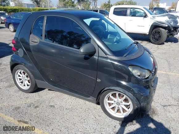 2009 Smart fortwo Pure with VIN WMEEJ31X49K218655, listed as a IAAI auction lot 40850458 with 243,075 mi miles. Bid and sale history available at carsss.com. Image 1.