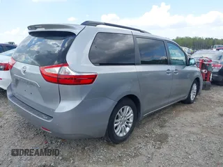 2015 Toyota Sienna XLE with VIN 5TDYK3DC7FS659864, listed as a IAAI auction lot 41958112 with 121,257 mi miles and . Bid and sale history available at DreamBid. Image 4.