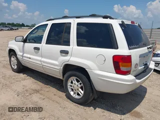 2004 Jeep Grand Cherokee Laredo with VIN 1J4GX48S94C222249, listed as a IAAI auction lot 42598242 with 196,745 mi miles and . Bid and sale history available at DreamBid. Image 3.