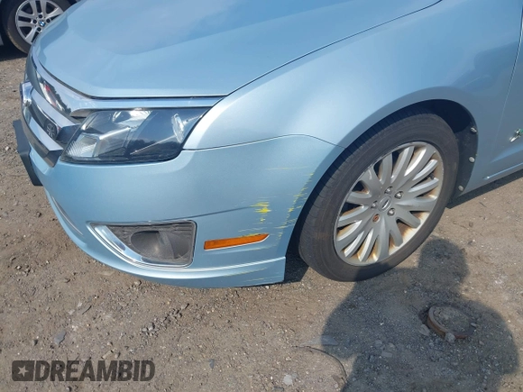 2010 Ford Fusion Hybrid z VIN 3FADP0L35AR279780, wystawiony jako IAAI lot #42480146 z przebiegiem 148 080 mil mil oraz . Historia ofert i sprzedaży dostępna na DreamBid. Obrazek 6.