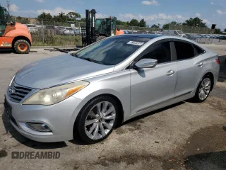 2013 Hyundai Azera z VIN KMHFH4JG8DA213103, wystawiony jako Copart lot #57781955 z przebiegiem 173 515 mil mil oraz Czysty tytuł • Clean title. Historia ofert i sprzedaży dostępna na DreamBid. Obrazek 1.