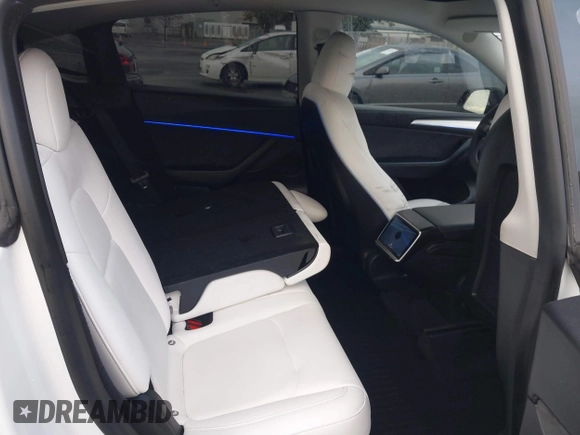2023 Tesla Model Y Performance with VIN 7SAYGDEF4PF738885, listed as a IAAI auction lot 41798997 with 59,270 mi miles and . Bid and sale history available at DreamBid. Image 8.