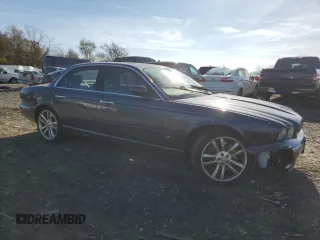 2004 Jaguar XJ with VIN SAJWA73B64TG28182, listed as a Copart auction lot 78380674 with 0 mi miles and Salvage Title. Bid and sale history available at carsss.com. Image 4.
