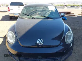 2013 Volkswagen Beetle 2.5L with VIN 3VWJP7ATXDM679115, listed as a IAAI auction lot 42212965 with Not Provided miles and . Bid and sale history available at DreamBid. Image 6.