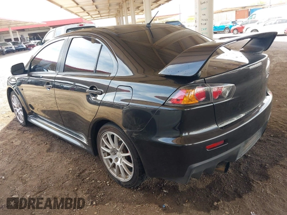 2013 Mitsubishi Lancer Evolution GSR with VIN JA32W8FV6DU009257, listed as a IAAI auction lot 41917942 with 125,279 mi miles. Bid and sale history available at carsss.com. Image 3.