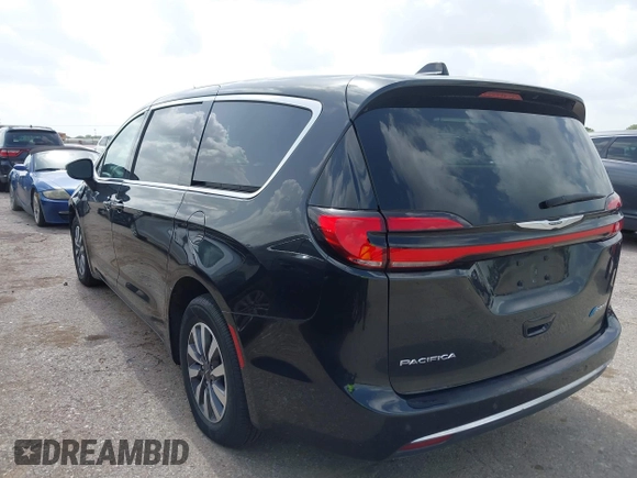 2023 Chrysler Pacifica Hybrid Touring L with VIN 2C4RC1L75PR611901, listed as a IAAI auction lot 42626500 with 44,156 mi miles and . Bid and sale history available at DreamBid. Image 3.