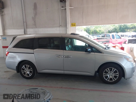 2012 Honda Odyssey EX-L with VIN 5FNRL5H67CB005013, listed as a IAAI auction lot 42295586 with 200,611 mi miles and . Bid and sale history available at DreamBid. Image 13.