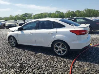 2016 Ford Focus Titanium z VIN 1FADP3J25GL201003, wystawiony jako Copart lot #53799745 z przebiegiem 194 055 mil mil oraz Szkoda całkowita • Salvage title. Historia ofert i sprzedaży dostępna na DreamBid. Obrazek 2.