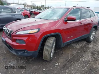 2014 Jeep Cherokee Latitude with VIN 1C4PJMCS0EW261021, listed as a IAAI auction lot 41986701 with 114,633 mi miles. Bid and sale history available at carsss.com. Image 14.