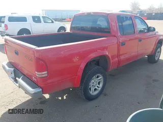2002 Dodge Dakota SLT z VIN 1B7HG48N32S518455, wystawiony jako IAAI lot #41652316 z przebiegiem 234 856 mil mil oraz . Historia ofert i sprzedaży dostępna na DreamBid. Obrazek 4.