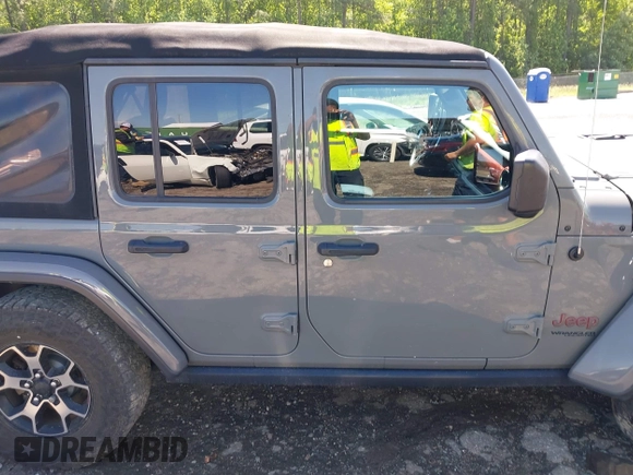 2018 Jeep Wrangler Unlimited Rubicon with VIN 1C4HJXFG6JW267087, listed as a IAAI auction lot 42235058 with 93,962 mi miles and . Bid and sale history available at DreamBid. Image 12.