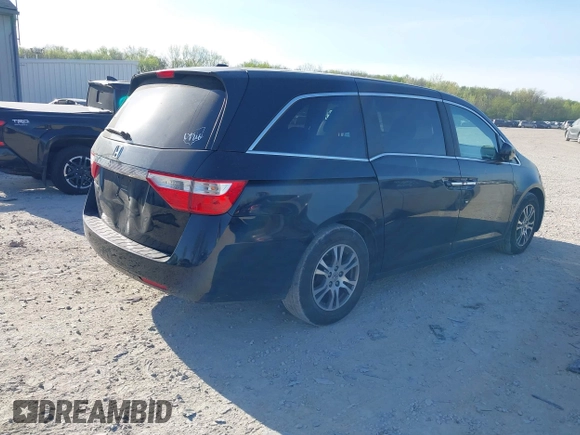 2012 Honda Odyssey EX-L with VIN 5FNRL5H6XCB016801, listed as a IAAI auction lot 42112141 with 164,671 mi miles and . Bid and sale history available at carsss.com. Image 4.