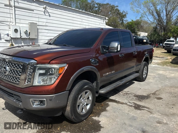 2016 Nissan Titan SL z VIN 1N6BA1F20GN510413, wystawiony jako Copart lot #48017425 z przebiegiem 225 717 mil mil oraz Czysty tytuł • Clean title. Historia ofert i sprzedaży dostępna na DreamBid. Obrazek 2.
