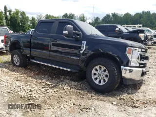 2020 Ford F-250 XL with VIN 1FT8W2BTXLEE30615, listed as a Copart auction lot 60626295 with 142,318 mi miles and Salvage title. Bid and sale history available at DreamBid. Image 4.
