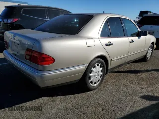 1998 Mercedes-Benz E-Class with VIN WDBJF65FXWA497997, listed as a Copart auction lot 87969125 with 145,322 mi miles and Salvage Title. Bid and sale history available at carsss.com. Image 3.