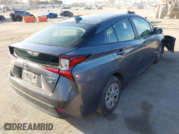 2022 Toyota Prius L Eco with VIN JTDKAMFUXN3188930, listed as a IAAI auction lot 42275661 with 116,934 mi miles and . Bid and sale history available at DreamBid. Image 4.