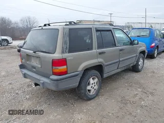 1995 Jeep Grand Cherokee Laredo with VIN 1J4GZ58S4SC555309, listed as a IAAI auction lot 41600141 with 130,493 mi miles. Bid and sale history available at carsss.com. Image 4.