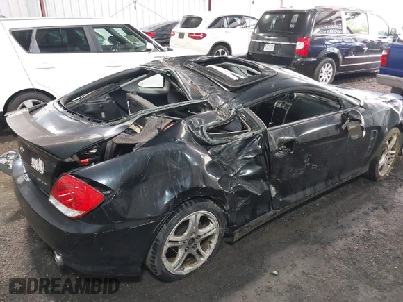 2005 Hyundai Tiburon GT z VIN KMHHN65F45U184777, wystawiony jako IAAI lot #42190342 z przebiegiem 213 013 mil mil oraz . Historia ofert i sprzedaży dostępna na DreamBid. Obrazek 6.