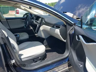 2013 Tesla Model S with VIN 5YJSA1CN0DFP21851, listed as a IAAI auction lot 42557791 with 106,328 mi miles and . Bid and sale history available at DreamBid. Image 5.