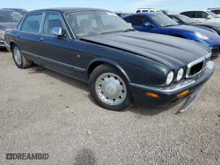 1999 Jaguar XJ with VIN SAJKX6047XC861227, listed as a Copart auction lot 75007414 with 0 mi miles and Salvage Title. Bid and sale history available at carsss.com. Image 4.