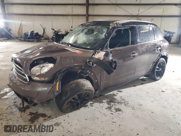 2015 MINI Countryman with VIN WMWZB3C52FWR44105, listed as a Copart auction lot 86780484 with Not Provided miles and Salvage Title. Bid and sale history available at DreamBid. Image 1.