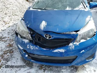 2014 Toyota Yaris L with VIN JTDKTUD34ED581773, listed as a IAAI auction lot 41620586 with 239,100 mi miles. Bid and sale history available at carsss.com. Image 6.