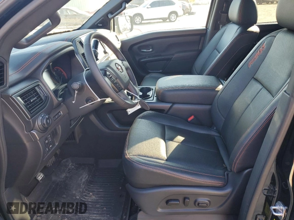 2024 Nissan Titan Pro-4X with VIN 1N6AA1ED6RN111104, listed as a Copart auction lot 46129425 with 4,903 mi miles and Salvage title. Bid and sale history available at DreamBid. Image 7.