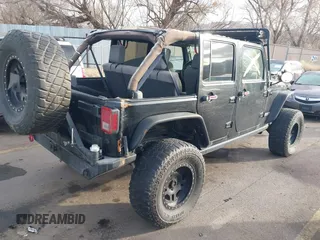2009 Jeep Wrangler Unlimited Rubicon z VIN 1J4GA69159L749215, wystawiony jako IAAI lot #41489893 z przebiegiem 177 768 mil mil oraz . Historia ofert i sprzedaży dostępna na DreamBid. Obrazek 4.