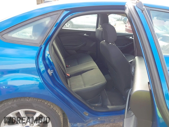 2018 Ford Focus SE z VIN 1FADP3F2XJL293337, wystawiony jako IAAI lot #42121294 z przebiegiem 71 241 mil mil oraz . Historia ofert i sprzedaży dostępna na DreamBid. Obrazek 8.