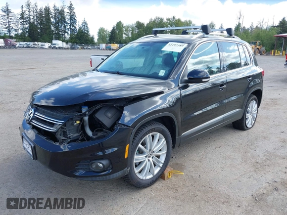 2012 Volkswagen Tiguan SE with VIN WVGBV7AX5CW561368, listed as a IAAI auction lot 42197389 with 63,809 mi miles and . Bid and sale history available at DreamBid. Image 2.