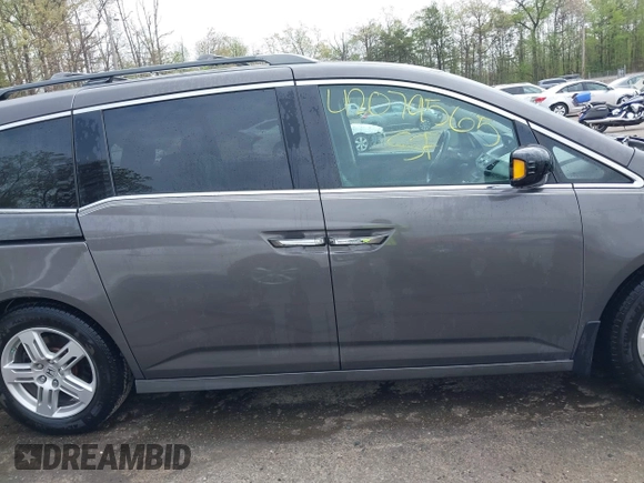 2013 Honda Odyssey Touring with VIN 5FNRL5H94DB013310, listed as a IAAI auction lot 42079565 with 128,622 mi miles and . Bid and sale history available at carsss.com. Image 13.