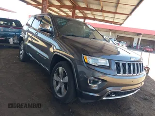2015 Jeep Grand Cherokee Overland with VIN 1C4RJFCG6FC877938, listed as a IAAI auction lot 42715030 with 101,130 mi miles and . Bid and sale history available at DreamBid. Image 1.