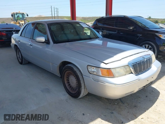 2001 Mercury Grand Marquis LS z VIN 2MEFM75W91X660964, wystawiony jako IAAI lot #42250931 z przebiegiem 74 462 mil mil oraz . Historia ofert i sprzedaży dostępna na DreamBid. Obrazek 1.