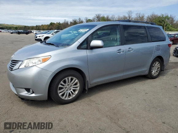 2015 Toyota Sienna XLE with VIN 5TDYK3DC2FS529006, listed as a Copart auction lot 62750995 with 142,990 mi miles and Salvage title. Bid and sale history available at DreamBid. Image 1.