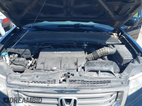 2013 Honda Ridgeline RTL with VIN 5FPYK1F57DB005538, listed as a IAAI auction lot 41985586 with 152,697 mi miles and . Bid and sale history available at DreamBid. Image 10.