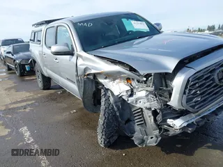 2021 Toyota Tacoma 4WD SR5 with VIN 3TMDZ5BN1MM105694, listed as a IAAI auction lot 41233853 with 1 mi miles. Bid and sale history available at carsss.com. Image 6.