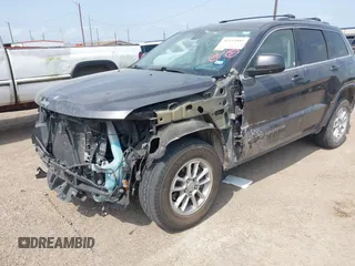 2020 Jeep Grand Cherokee Laredo E with VIN 1C4RJEAG2LC284912, listed as a IAAI auction lot 42114881 with 86,579 mi miles and . Bid and sale history available at DreamBid. Image 6.