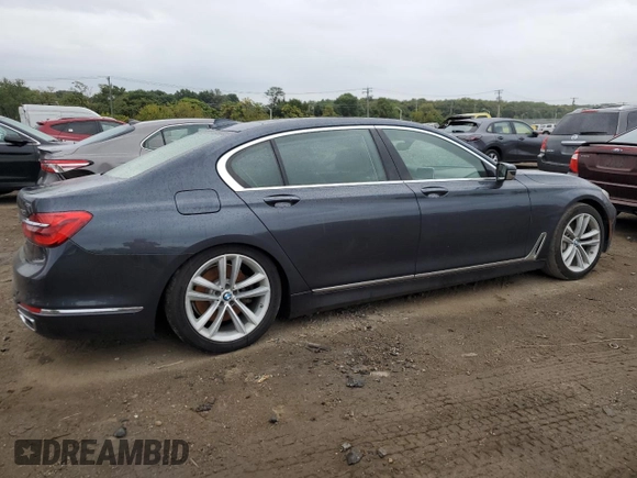 2016 BMW 7 Series 750i with VIN WBA7F0C54GGL99661, listed as a Copart auction lot 71742154 with 104,498 mi miles and Salvage Title. Bid and sale history available at carsss.com. Image 3.